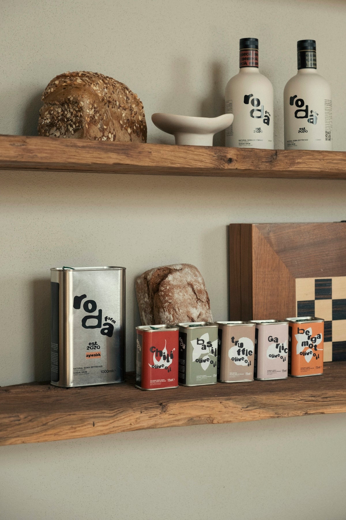 Bottles and cans of olive oil with bread.