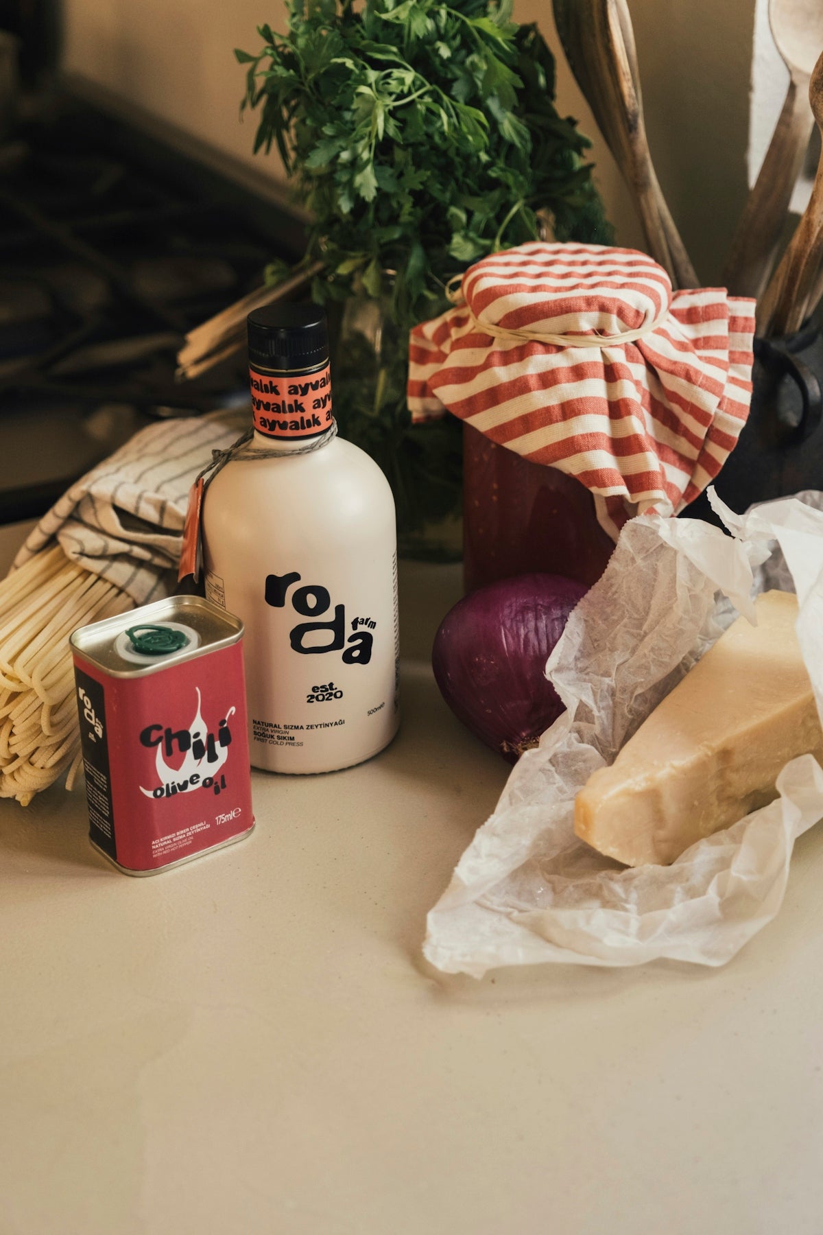Ingredients for cooking: oil, cheese, onion, herbs
